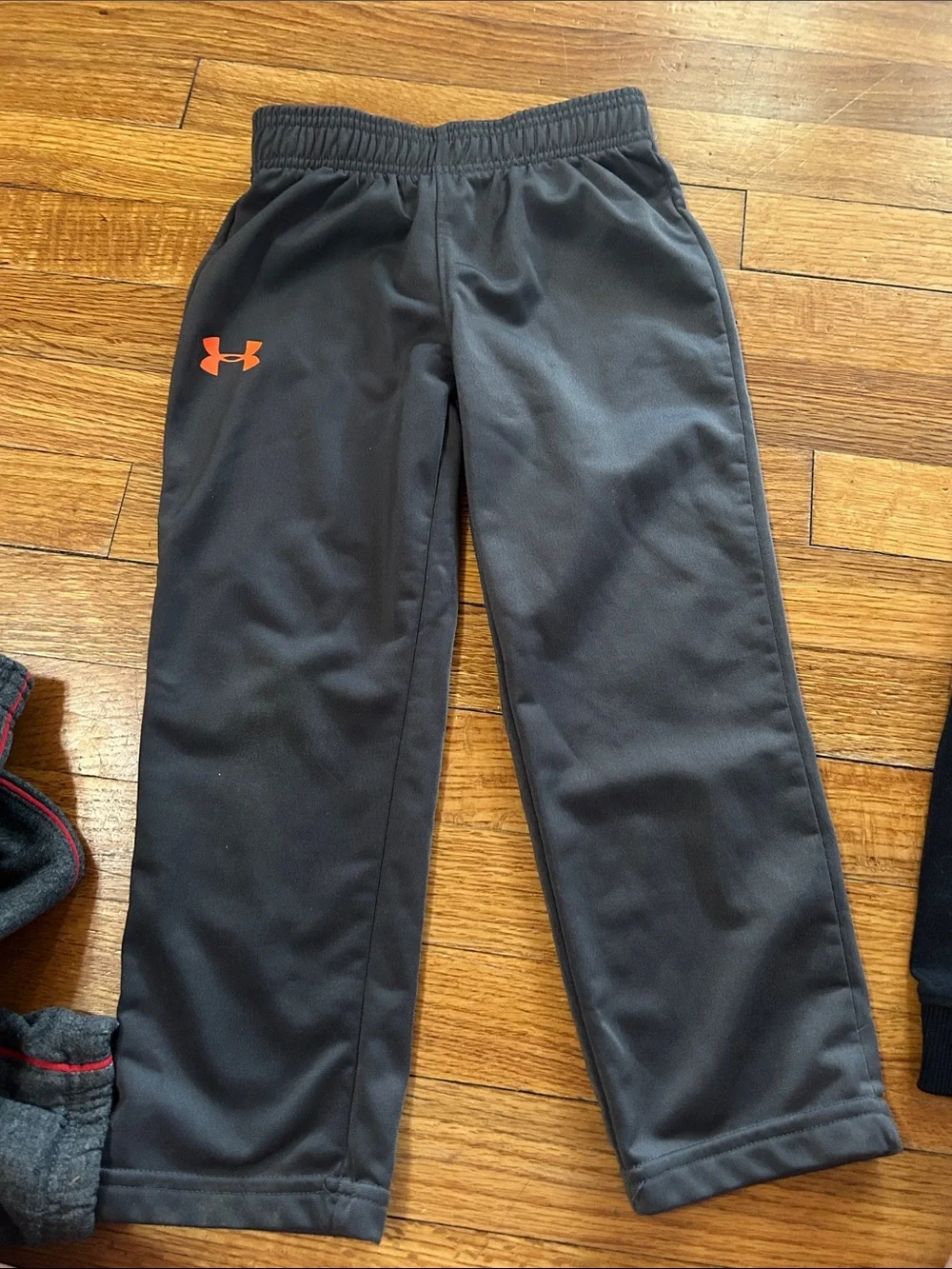 Under Armour Boys' Charcoal Gray Athletic Joggers with Orange Logo